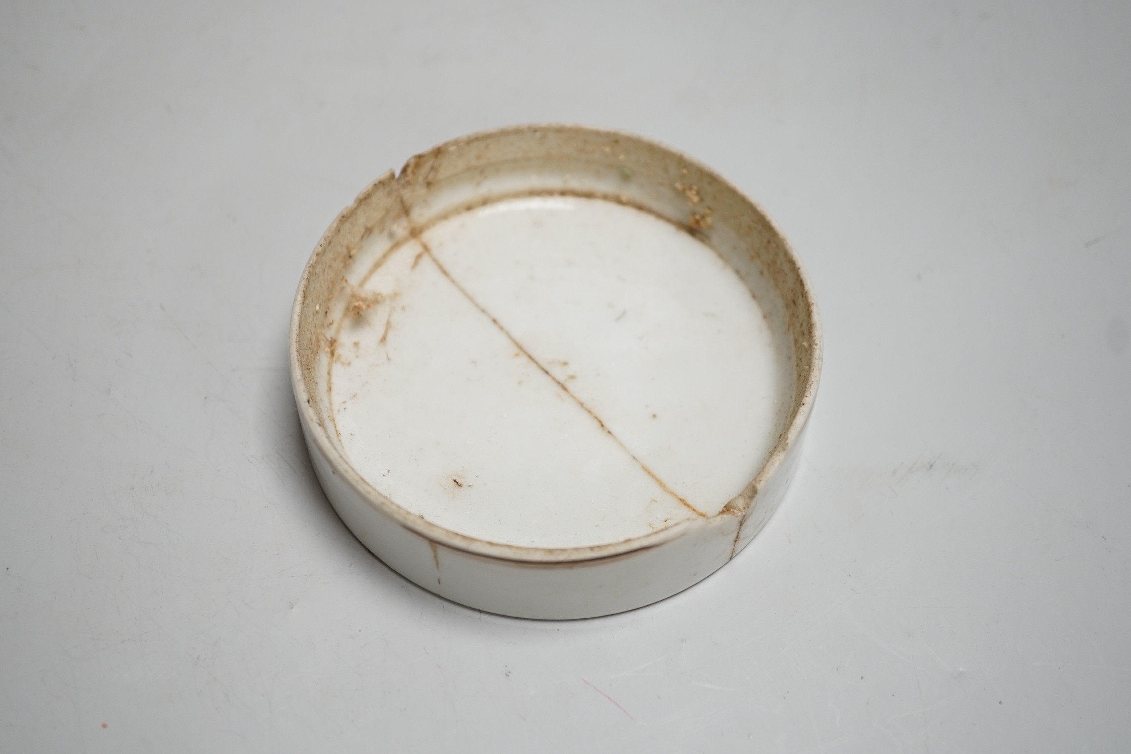 A 19th century Chinese famille rose cylindrical jar and cover, 11.5cm high, a blue and white prunus lamp and a Japanese eggshell porcelain cup